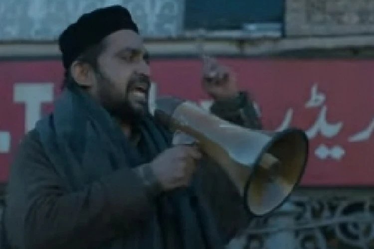 Terrorist instigates crowd scene.Kashmir files image